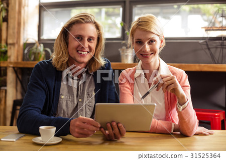 Colleagues using a tablet computer Colleagues using a tablet computer 31525364