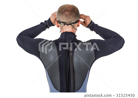 Rear view of swimmer in wetsuit wearing swimming goggles 31525450