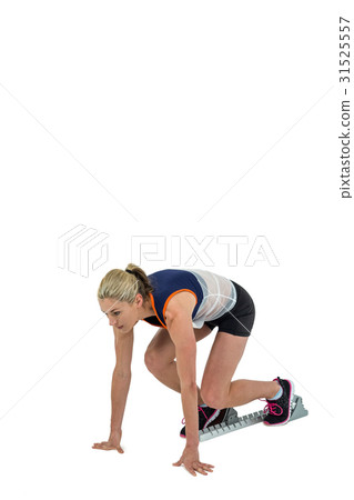 Female athlete in position ready to run Female athlete in position ready to run 31525557