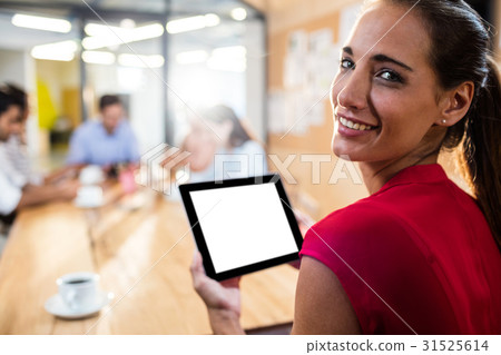 Hipster businesswoman using a tablet computer 31525614
