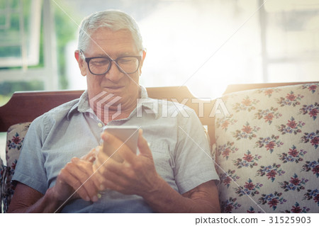 Senior man using mobile phone Senior man using mobile phone 31525903