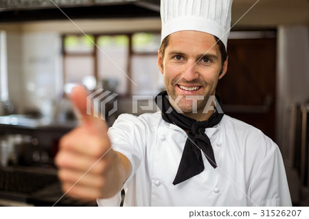 Portrait of smiling chef showing thumbs up Portrait of smiling chef showing thumbs up 31526207