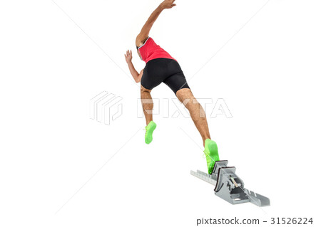 Male athlete running from starting blocks 31526224