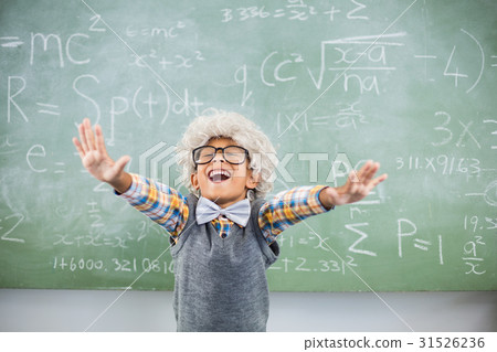 Excited schoolboy with hand spread in classroom Excited schoolboy with hand spread in classroom 31526236