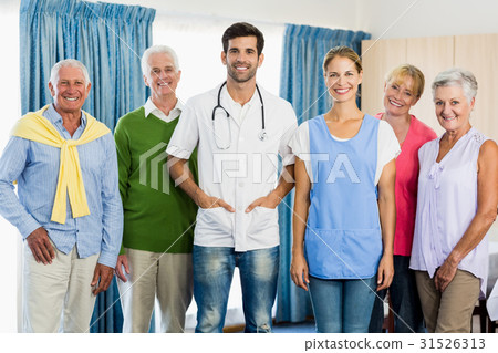 Nurse and seniors standing together 31526313