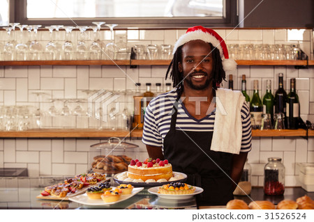 Happy hipster worker posing with Christmas hat Happy hipster worker posing with Christmas hat 31526524