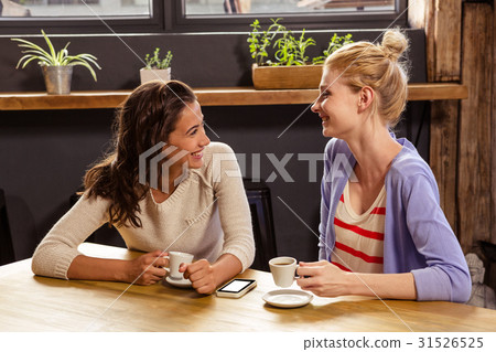 Smiling friends drinking coffee Smiling friends drinking coffee 31526525
