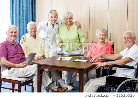 Seniors with wheelchair and walking aid Seniors with wheelchair and walking aid 31526526