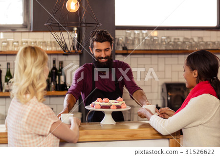 Bartender serving coffee to customers 31526622