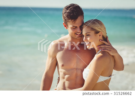 Couple romancing on beach Couple romancing on beach 31526662