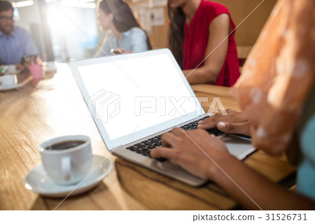 Hipster businesswoman using a laptop 31526731