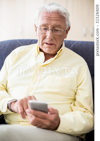 Senior using a smartphone Senior using a smartphone 31526809