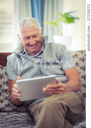 Senior man using digital tablet Senior man using digital tablet 31526815