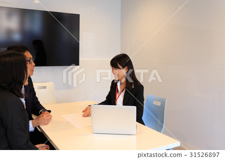 A couple receiving explanations from business image staff A couple receiving explanations from business image staff 31526897