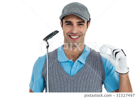 Golf player showing golf ball and holding golf club 31527497