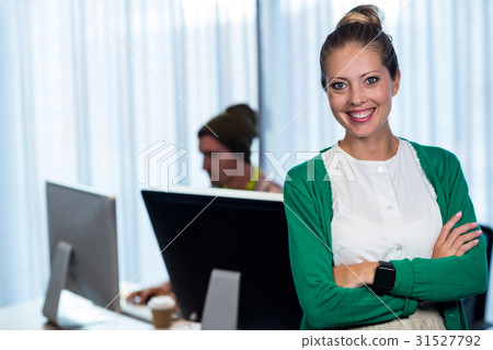 Businesswoman posing front of her coworker 31527792