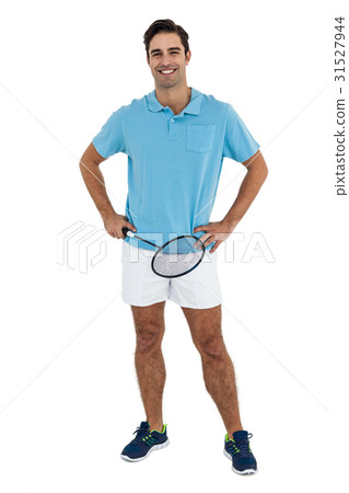 Portrait of badminton player standing with hands on hips Portrait of badminton player standing with hands on hips 31527944