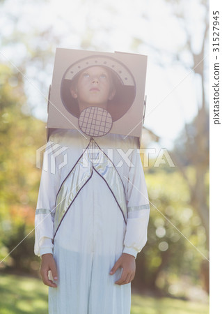 Boy pretending to be an astronaut Boy pretending to be an astronaut 31527945