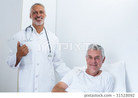 Portrait of happy male doctor and senior man Portrait of happy male doctor and senior man 31528092