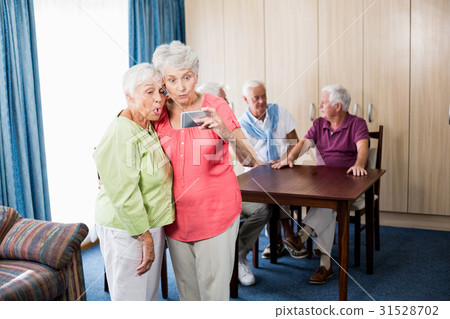 Senior women taking a selfie Senior women taking a selfie 31528702