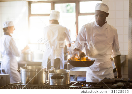 Chef cooking in kitchen stove Chef cooking in kitchen stove 31528955