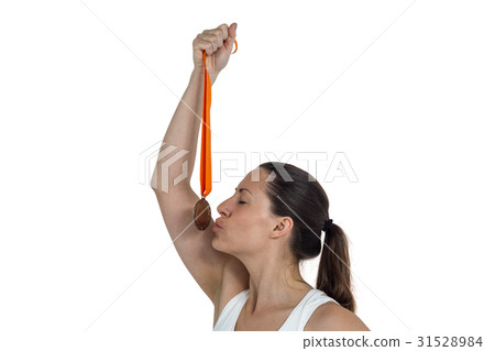 Happy athlete kissing medal Happy athlete kissing medal 31528984