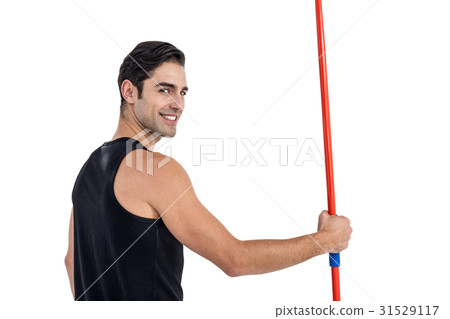 Portrait of happy male athlete holding javelin 31529117