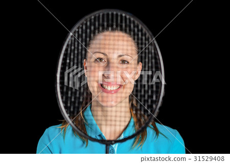 Female athlete posing with badminton racket 31529408
