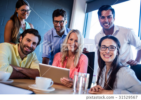 Group of creative businessmen using a tablet computer 31529567
