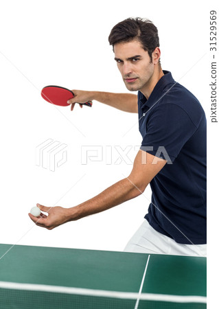 Confident male athlete playing table tennis 31529569