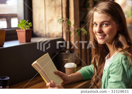 Attractive girl posing with book 31529631