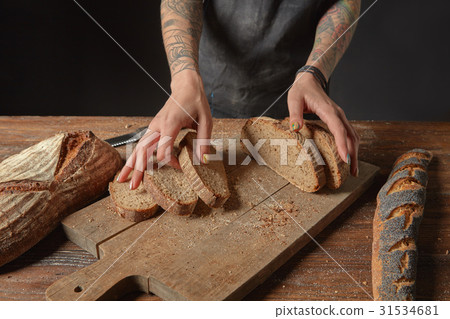 Baker Holds Bran Bread 31534681