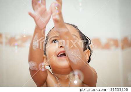 Child little girl bathing and playing with bubble 31535396