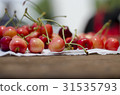 Red sweet cherries on the table 31535793