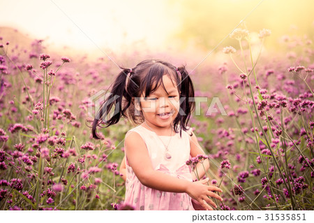 happy little girl running and having fun in park happy little girl running and having fun in park 31535851
