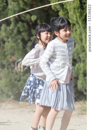 Elementary school student jumping rope 31536822