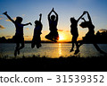 silhouette of friends jumping in sunset 31539352