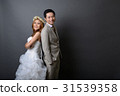 young asian groom and bride smiling in studio 31539358