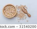 Chickpea and olive wood scoop in a wooden cup 31540200