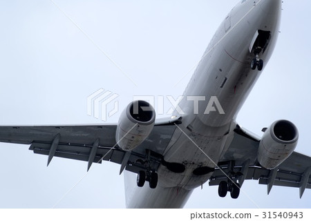 The underside of a modern airplane with its flaps The underside of a modern airplane with its flaps 31540943