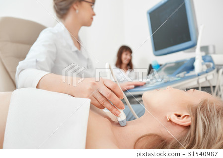 Young woman getting ultrasound scanning 31540987
