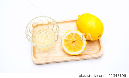 lemons on a wooden plate. lemons on a wooden plate. 31542106