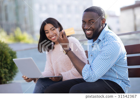 Charming savvy people making purchases anytime 31542367