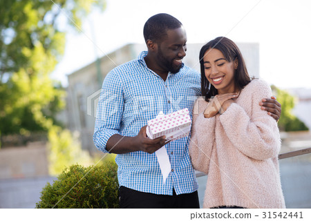 Gallant creative guy receiving a surprise gift 31542441