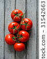 Group of ripe tomatoes 31542663