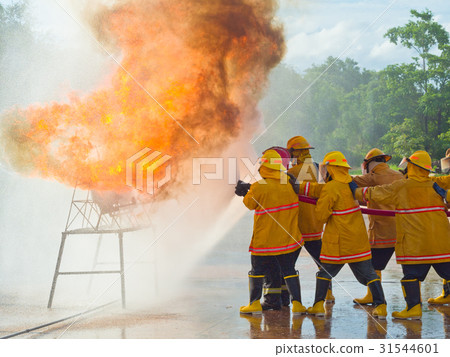 Firefighters training. spraying water. 31544601