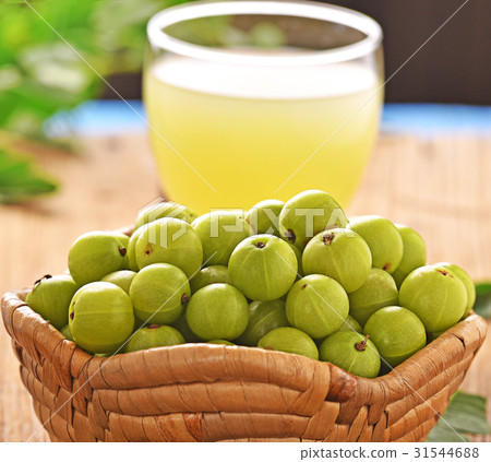 Indian gooseberry  juice on the wooden floor 31544688