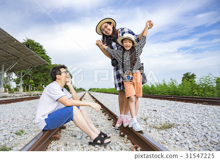 Asian family enjoy taking photo at train station 31547225