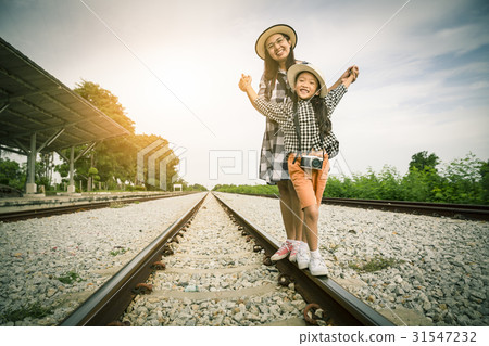 Happy asian family enjoy taking photo on railway 31547232