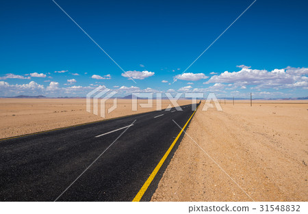 vibrant image of highway and blue cloudy sky 31548832